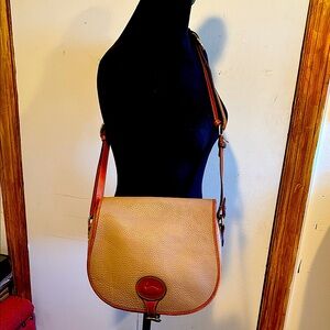 Year round color Dooney and Burke vintage shoulderbag,many pockets and D&B charm